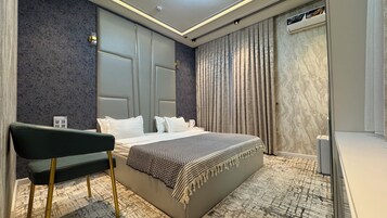Habitación Deluxe doble de uso individual, vistas a la ciudad | Zona de estar