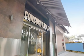 A building with a sign that reads 'CONCORD GALAXY'. - Aboo's Hotel Concord Galaxy by Zuzu (Mumbai)