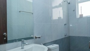 A bathroom with a white sink, a mirror, a towel rack, and a window. - The Hideout - 2Br Villa Near Kahathuduwa Interchange (Polgasowita)