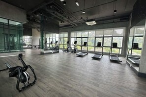 A gym with treadmills, stationary bikes, and exercise equipment. - Sunway Onsen Suites, Lost World of Tambun Ipoh (Ulu Kinta)