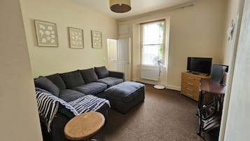 Standard Apartment | Living area | 42-inch LCD TV with satellite channels