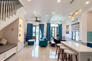 Living area - 3 bedroom seafront Cherry Villa - Novaworld Phan Thiet (Phan Thiet)