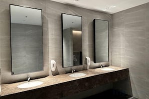 A restroom with three sinks, each with a mirror above. - The Peak Residence, Multi-Apartment by Emma (Phnom Penh)