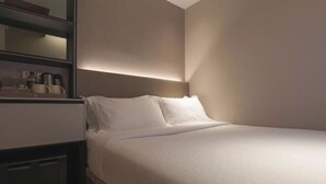 A hotel room with a bed, bedside table, and a wall-mounted shelf with items. - Hotel 1900 Express @ Chinatown (Short Overnight, 15 Hours, 6PM-9AM) (Singapore)