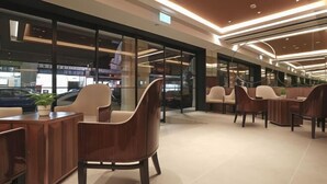A modern hotel lobby with a spacious seating area, large windows, and a contemporary design. - Hotel 1900 Express @ Chinatown (Short Overnight, 15 Hours, 6PM-9AM) (Singapore)