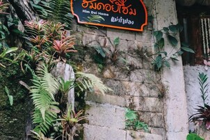 A sign with text in a non-Latin script, possibly indicating a location or establishment.