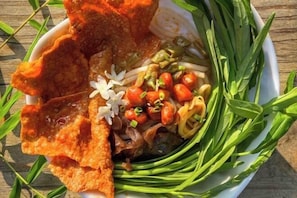 A bowl of food with various ingredients. - Lighthouse Inn Corporation former Lucky Tito D'mall Boracay (Boracay Island)