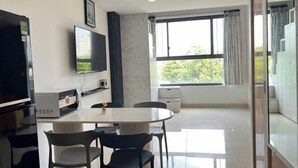 A modern kitchen with a built-in oven, a microwave, and a coffee machine. - The Wellington Homes - Botanica Premier Apartment - Nearby Airport Free Pool Gym (Ho Chi Minh City)