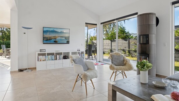 A modern living room with a large window, a fireplace, and a view of the outdoors. - "Alvia" - 1.6km from the sea by Interhome (Græsted)