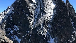 A rugged mountain peak with snow patches and a clear blue sky. - Blue Zone Kenya Resorts and Game Drives (Nanyuki)