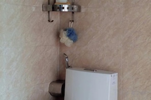 A bathroom with a white sink, a towel rack, and a toilet paper holder. - Villa Pleiku City (Pleiku)