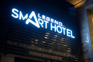 A hotel sign with the name 'Legend Smart Hotel' and a phone number. - Legend Smart Hotel (Hanoi)