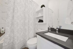 Shower, hair dryer, towels - Multi-Unit Condo Building in Chicago (Chicago)