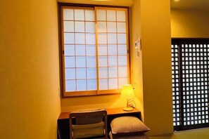 A room with a window, a lamp, a chair, and a bed. - HAKUKOU UROMURO (Kyoto)