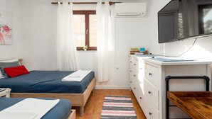 A bedroom with two beds, a desk, a TV, and a window with curtains. - ZadarVillas Off-Grid Private Island Retreat (Sali)