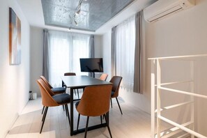 A modern conference room with a long table, six chairs, a flat-screen TV, and a whiteboard. - Leclerc Higashi-Shinjuku (Shinjuku)