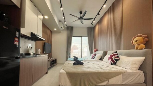 A modern hotel room with a bed, a small desk, a ceiling fan, and a large window. - The Pano at Jalan Ipoh Near KLCC By The Homez (Kuala Lumpur)