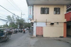 A building with a sign for 'Pension Inn' and a visible entrance.