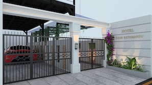 A gated entrance to a hotel with a sign reading "HOTEL TULSI KATHMANDU". - Tulsi Kathmandu Hotel (Kathmandu)