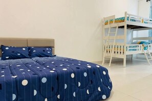 A bedroom with a bed, a bunk bed, and a window.