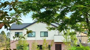 A modern two-story building with a flat roof, large windows, and a brick facade. - Yume Terrace at Yachimata (Yachimata)
