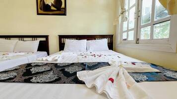 Family Room, Balcony, Sea View | Blackout drapes, iron/ironing board, free WiFi