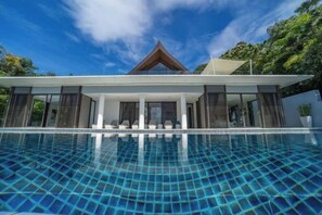 A modern house with a swimming pool in front. - 6BR Oceanfront Luxury Villa 30m Infinity Pool Villa Serenity Warm Plus (Phuket)