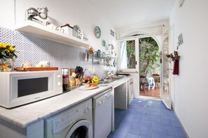 Fridge, oven, electric kettle, cookware/dishes/utensils