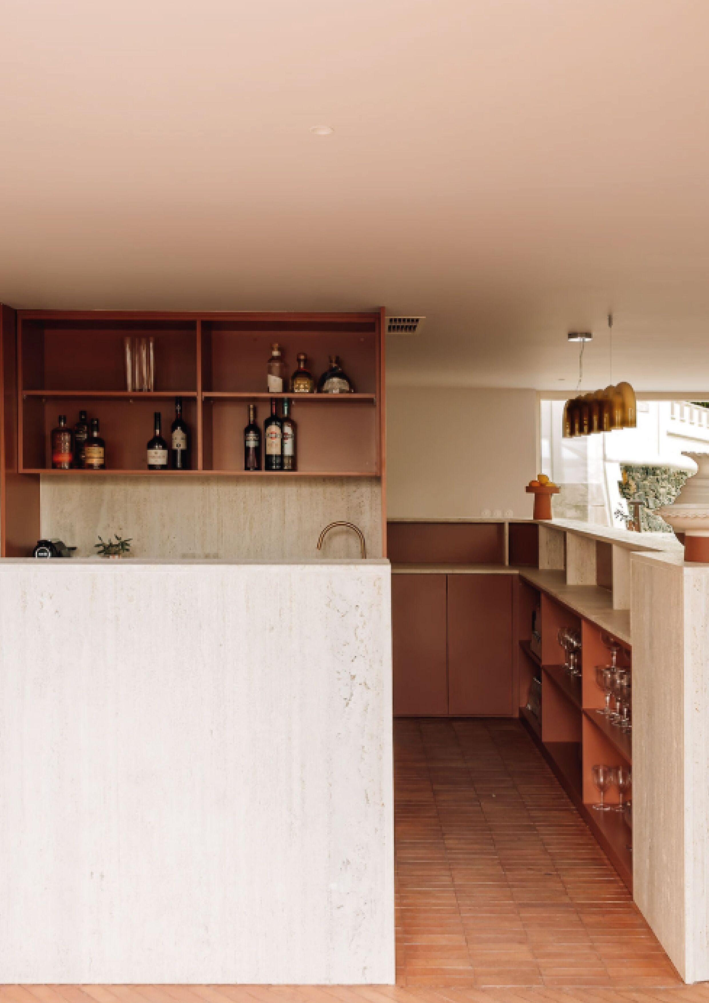 A modern kitchen with wooden shelves, a marble countertop, and a wooden floor.