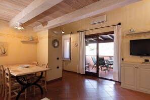Apartment, 2 Bedrooms | Living area | 30-inch TV with satellite channels - Casa Onda Marina by Wonderful Italy (Porto Rotondo)