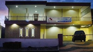 A two-story building with a sign reading "NAYALA HOME" and a banner for "KAYALA HOMES". - Urbanview @ Nalaya Homestay Mataram (East Cakranegara)