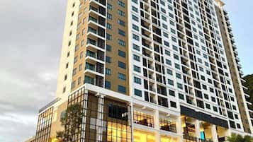 A high-rise hotel with multiple floors, large windows, and a modern architectural design.