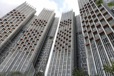 A high-rise building with multiple floors, vertical lines, and balconies.. Lumi @ Tropicana PJ GolfClub Balcony 5 pax