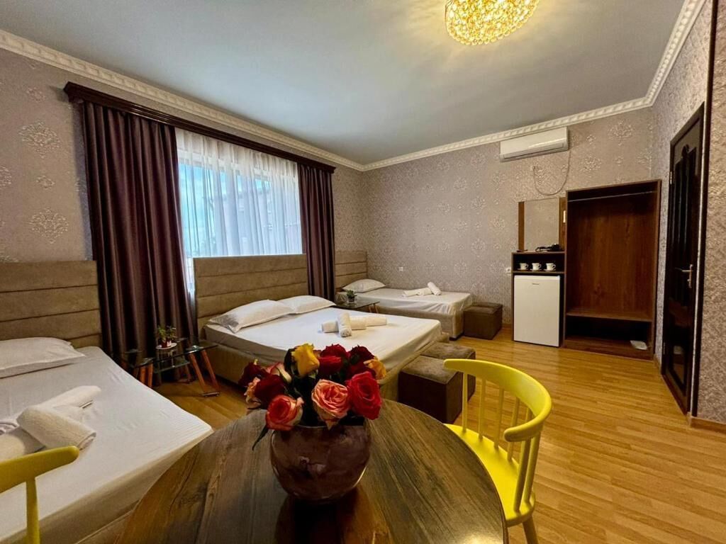 Family Triple Room, Courtyard View | Desk, laptop workspace, soundproofing, iron/ironing board