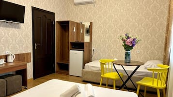 Superior Twin Room, Courtyard View | Desk, laptop workspace, soundproofing, iron/ironing board