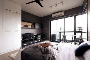 A modern bedroom with a bed, a desk, a chair, and a large window. - Lily & Loft - The Grand Sofo, Petaling Jaya (Petaling Jaya)