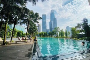 A swimming pool with a city skyline in the background. - Agile SkyView Suites KL (Kuala Lumpur)