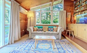 TV, fireplace - Haven on the Hill | Modern 3BR - Panoramic Views (Rotorua)