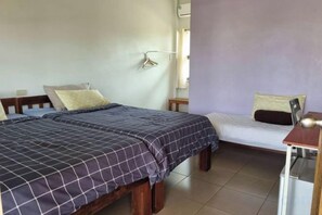A room with two beds, a desk, and a chair. - Korp View House (Wang Nam Khiao)