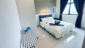 A modern bedroom with a bed, a nightstand, a mirror, and a window with curtains. - Desaru Utama A14 by UcomeHomestay (Bandar Penawar)