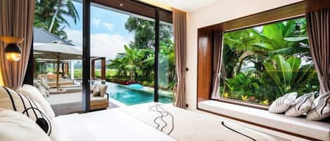 A bedroom with a large bed, a view of a swimming pool, and a window with curtains.