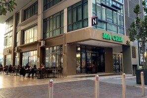 A modern building with a cafe named 'MA CHIK' on the ground floor. - CONEZION BY FEEL HOME (Serdang)