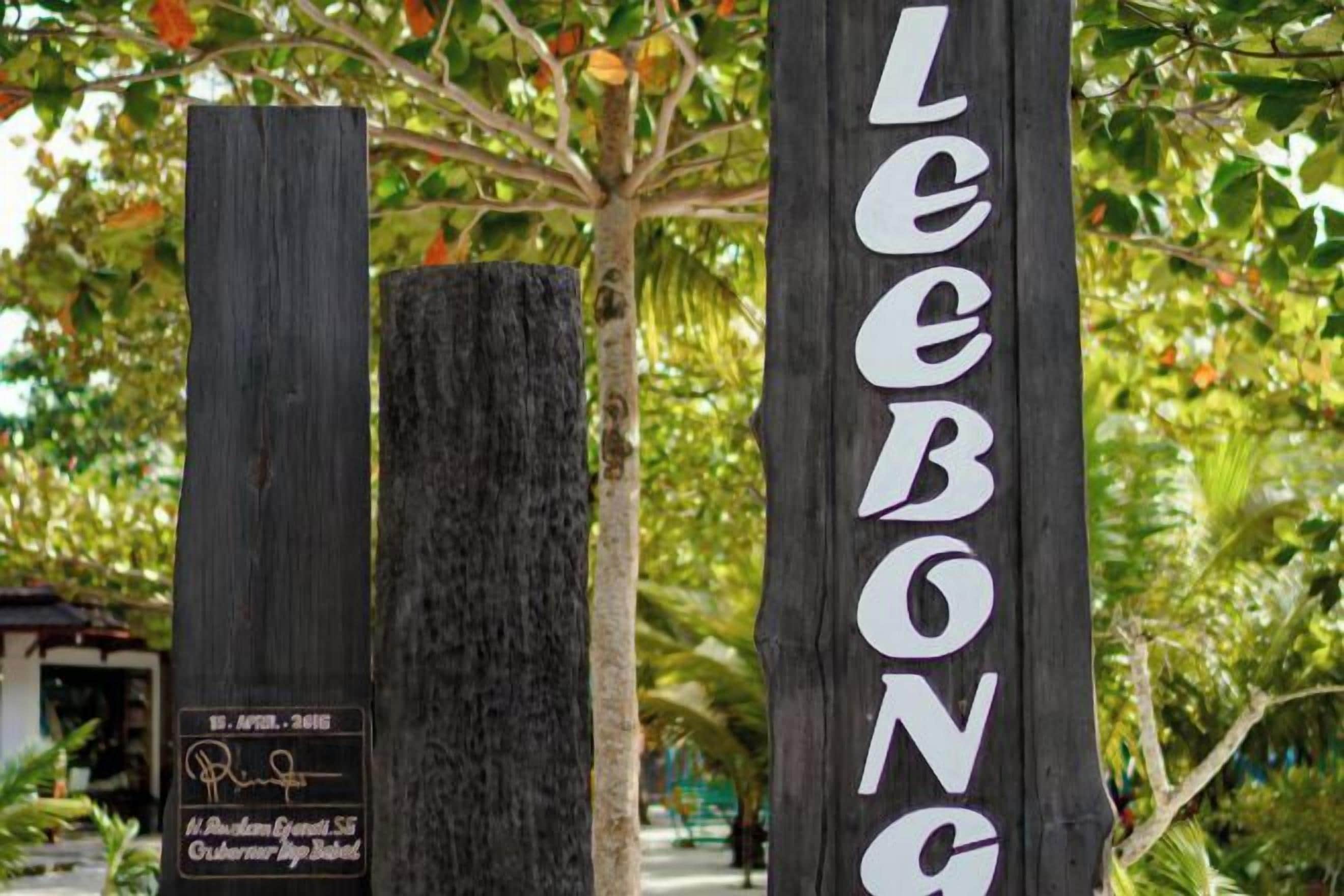 A wooden sign with the name 'LEEBONGA' and a plaque with text.