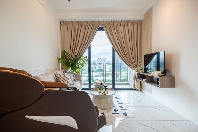 A modern living room with a sofa, a coffee table, and a TV.