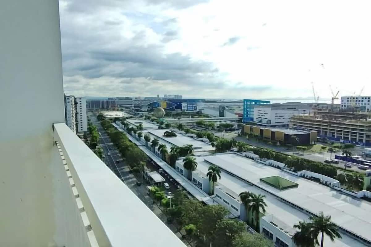 A view of a modern urban area with buildings, roads, and greenery.