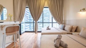 A hotel room with two beds, a desk, a chair, and a large window with curtains. - ELEMENT BY FEEL HOME(The elements@Ampang) (Kuala Lumpur)