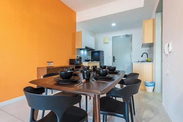 A compact kitchen with a dining area.