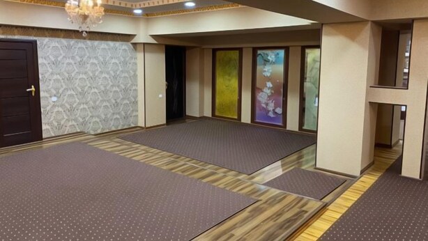 A room with tatami mats, a chandelier, and a traditional Japanese sliding door. - N&J Hotel-Process equipment only (Jizzakh District)