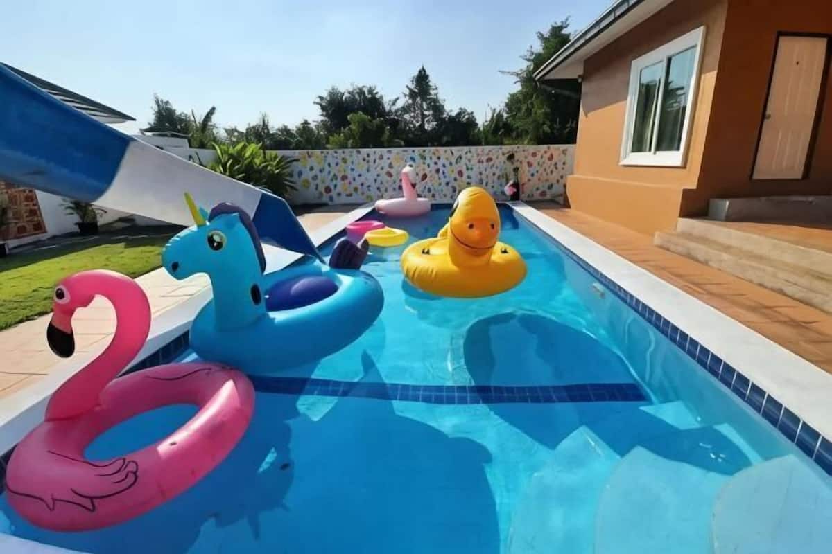 A swimming pool with inflatable toys.
