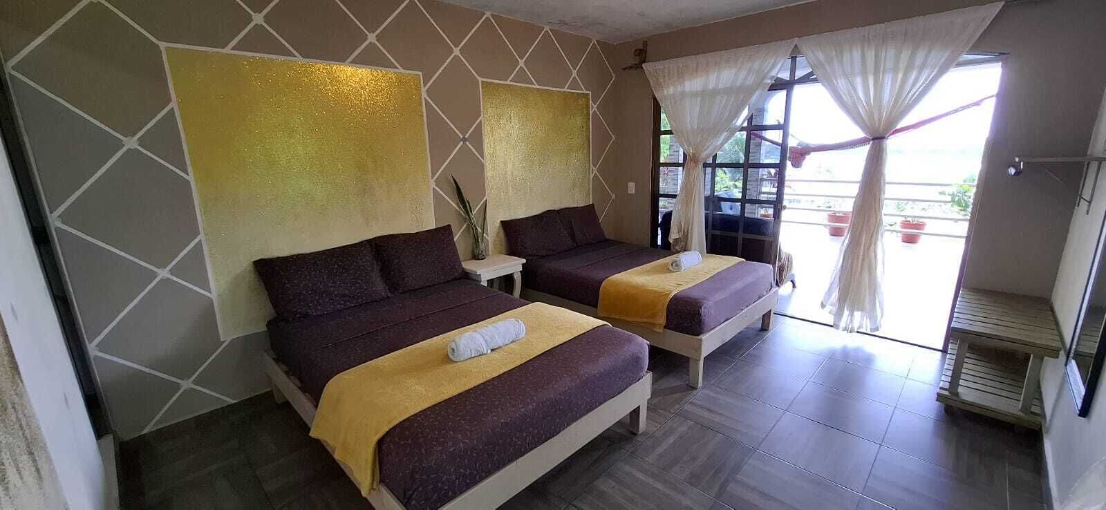 Habitación doble familiar, balcón, vista a la laguna | Wifi gratis y ropa de cama 